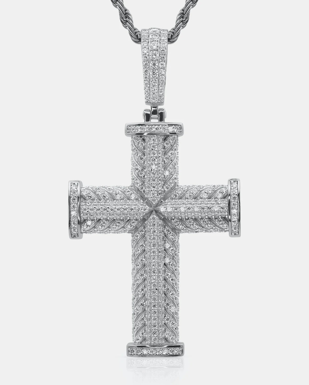Front view of the ĀXŌN 925 silver cross pendant with brilliant-cut pavé moissanite stones on a twisted chain — AETHER