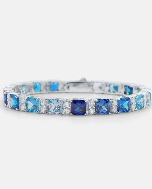 Front view of the HORIZŌN 925 silver tennis bracelet with deep and light blue cushion-cut cubic zirconia and pavé moissanite accents — AETHER