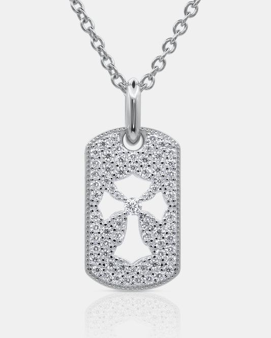 Front view of the PHYLÁKTÓN 925 silver tag pendant with pavé moissanite stones and a central cross cutout on a silver chain — AETHER