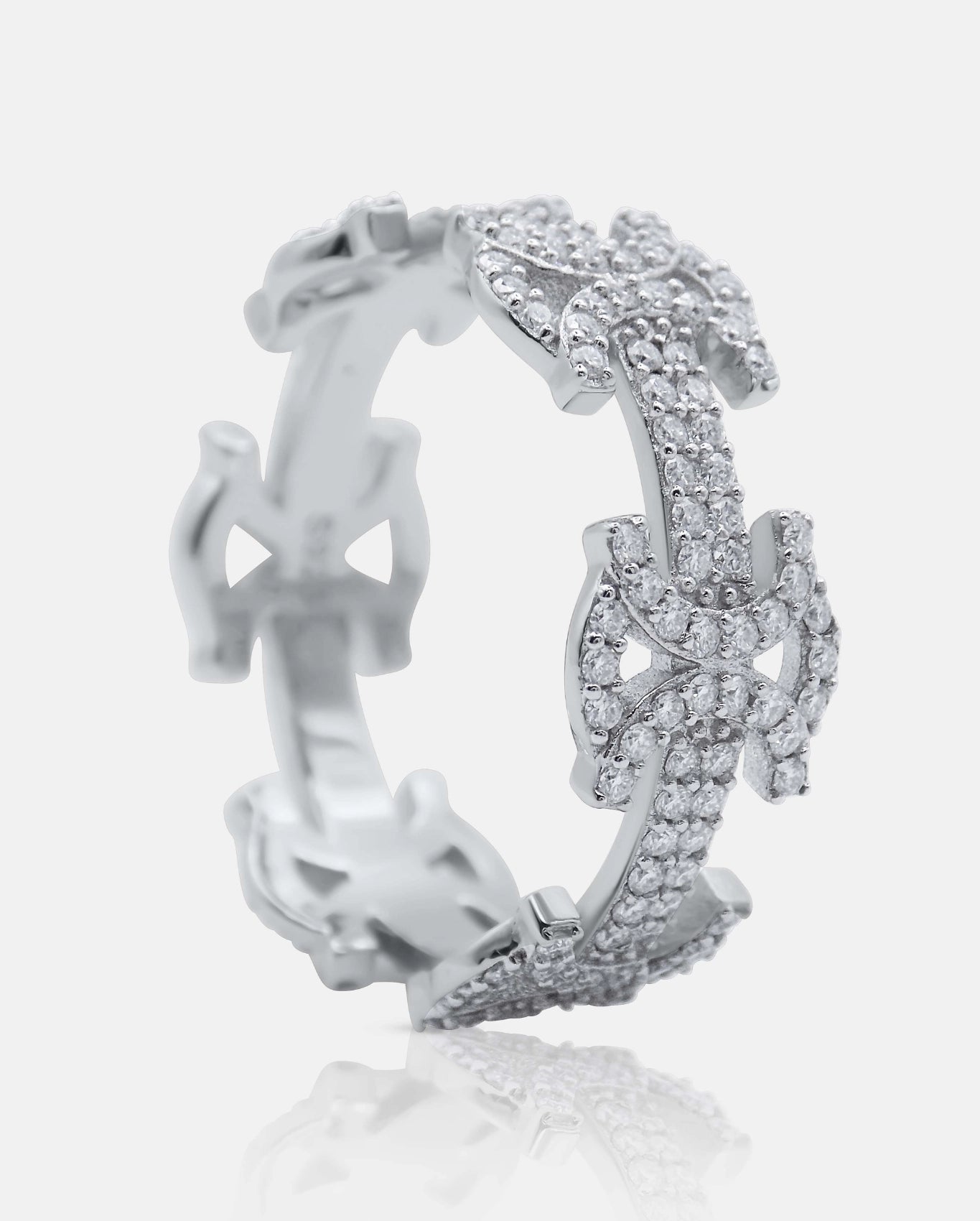 Angled side view of the SYMMETRIA 925 silver ring with pavé VVS moissanite stones and repeating geometric motifs — AETHER