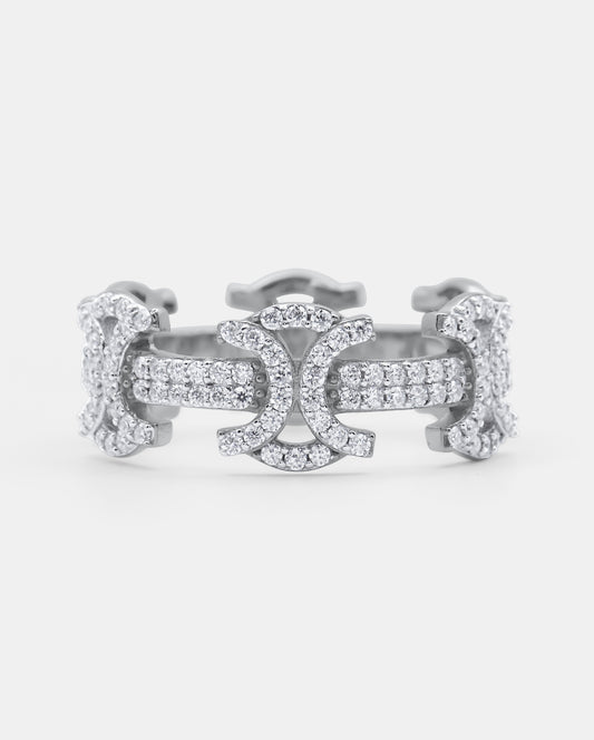 Front view of the SYMMETRIA 925 silver ring with pavé VVS moissanite stones and repeating geometric motifs — AETHER
